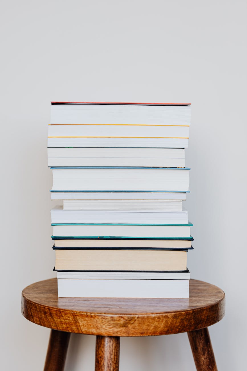 stack of books on wooden stool
